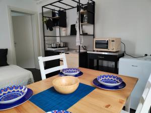 a dining room table with blue and white plates on it at Da Francesca in Meduno