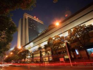 a building on a city street at night at Changsha Huatian Hotel in Changsha
