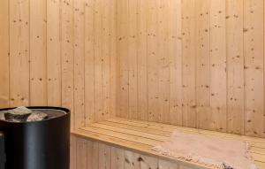a corner of a sauna with a trash can at Marina Fiskenæs Feriepark in Egernsund +19 photos