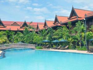 a resort with a large swimming pool and a building at Sokhalay Angkor Residence and Spa in Siem Reap