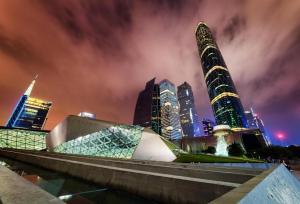 a view of a city with tall buildings at night at Lavande Hotel Guangzhou Financial City Tianhe Park Metro Station in Guangzhou