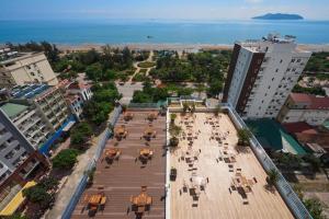 an aerial view of a city with tables and chairs at Thai An Hotel in Cửa Lò