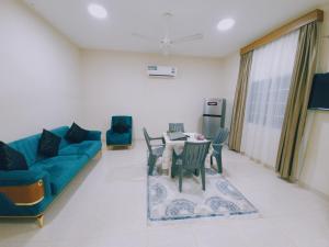 a living room with a couch and a table at أجاويد 2 Ajaweed in Salalah