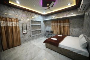 Ένα ή περισσότερα κρεβάτια σε δωμάτιο στο Maa vishalakshi home stay