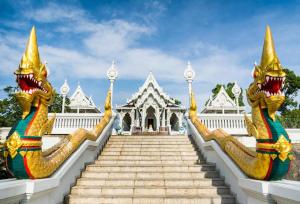 a set of stairs in front of a white building at Doungta Anda Hotel Krabi in Ban Khlong Chi Lat