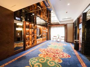 a large room with a large rug on the floor at Inner Mongolia Hotel Forbidden City in Beijing +98 photos