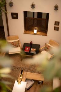 A seating area at HOTEL BOUTIQUE ALMA ANDALUSí