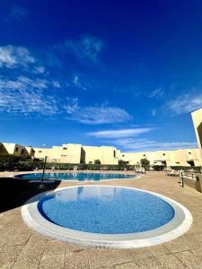 a large swimming pool in the middle of a building at Sol & Mar in El Médano