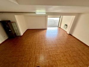 an empty room with a tiled floor in an empty building at Sol & Mar in El Médano
