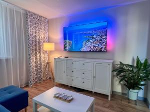 TV a/nebo společenská místnost v ubytování Heron