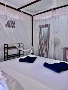 Ένα ή περισσότερα κρεβάτια σε δωμάτιο στο SunFly Villa