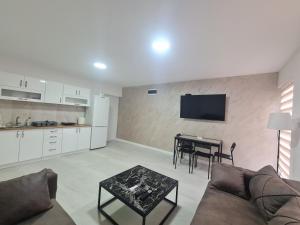 a living room with a couch and a table at Marash apartman 2 in Belgrade
