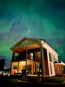a large house with a balcony on the side of it at Villa Golden House in Rovaniemi