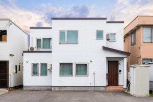 an image of a white house at The Serenity in Obihiro