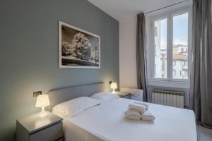 Postel nebo postele na pokoji v ubytování Easylife - Classic and Comfy Porta Romana Flat