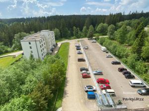 an aerial view of a parking lot with cars at 2-1 - Raum - Ferienappartements Dieter Hoffmann Freudenstadt-Kniebis beim Nationalpark in Freudenstadt