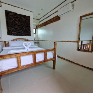 Rúm í herbergi á The Hat Trick Hostel