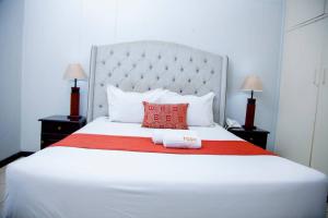 Postel nebo postele na pokoji v ubytování The Grand Selous Hotel & Conference Centre