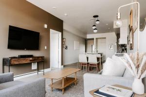 a living room with a couch and a table at Contemporary Cool Lifestyle Loft - Zuni Lofts in Denver