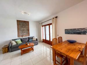 a living room with a couch and a table at Juwel des Meeres Nudist Place FKK Complejo Nudista - Charco del Palo - in Charco del Palo