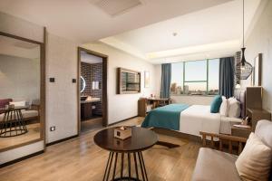Ein Bett oder Betten in einem Zimmer der Unterkunft Mehood Lestie, Zhangbaliu Road, Xi'an High-tech Zone