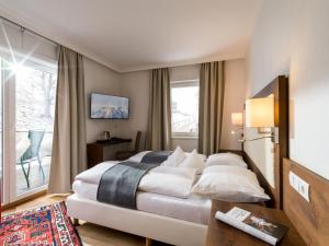 Voodi või voodid majutusasutuse Hotel Gasthof Blaue Quelle toas