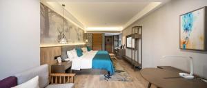 Ein Bett oder Betten in einem Zimmer der Unterkunft Mehood Lestie, Zhangbaliu Road, Xi'an High-tech Zone