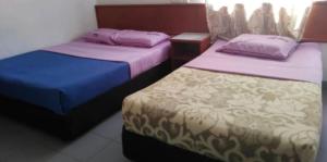 Voodi või voodid majutusasutuse Dung Fang Hotel toas