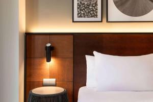 a hotel room with a bed and a table at Dolce by Wyndham Barcelona Resort in Sant Esteve Sesrovires