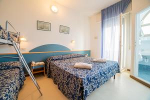 Postel nebo postele na pokoji v ubytování Hotel Golf