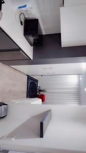 a kitchen with a white counter and a sink at Spectacular view at 1on Albert in Cape Town