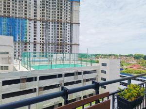 an apartment balcony with a view of a building at D'bey Melaka Homestay in Bukit Baru