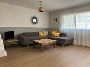 a living room with a couch and a table at Pool House Mencey in El Médano