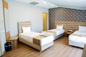 Postel nebo postele na pokoji v ubytování King City Hotel Istanbul Ataturk Airport + 37 fotografií