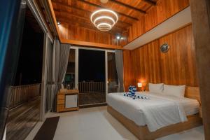 Giường trong phòng chung tại Dijobi Villa Bali +43 ảnh