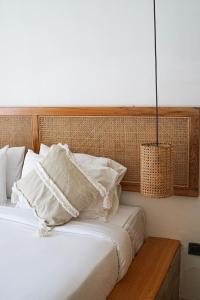 Postel nebo postele na pokoji v ubytování Villa Mimpi - Bela Sulu Villas