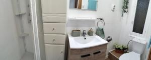 a white bathroom with a sink and a toilet at Ricardo Hostal Apartamento in Alicante +19 photos