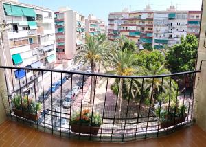 a balcony with a view of a city at Ricardo Hostal Apartamento in Alicante