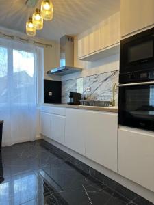 Η κουζίνα ή μικρή κουζίνα στο Chic & Confort F3 +11 φωτογραφίες