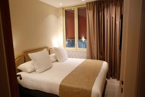 Postel nebo postele na pokoji v ubytování Splendid Hôtel & Spa
