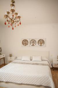 Ένα ή περισσότερα κρεβάτια σε δωμάτιο στο Sunny House La Eliana +27 φωτογραφίες