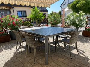 a black table and chairs on a patio at Ferienhaus Weins in Lieg