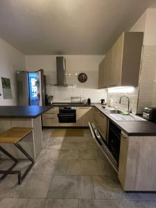 a kitchen with a sink and a counter top at Rustic Apartment -100mt from BerninaExpress in Tirano +23 photos