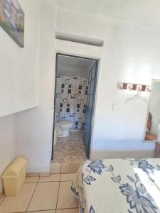 Postel nebo postele na pokoji v ubytování Hotel Las Palomitas