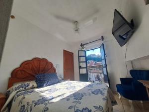 Postel nebo postele na pokoji v ubytování Hotel Las Palomitas