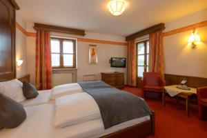 Postel nebo postele na pokoji v ubytování Hotel Kurpark