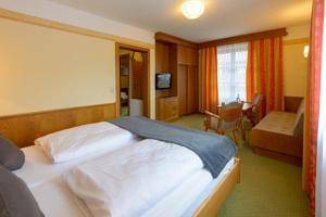 Postel nebo postele na pokoji v ubytování Hotel Kurpark