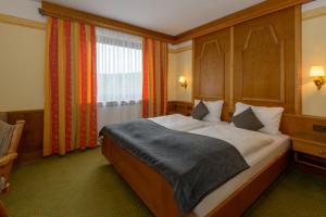 Postel nebo postele na pokoji v ubytování Hotel Kurpark