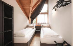 Posteľ alebo postele v izbe v ubytovaní Hotel Löwenhof