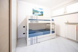 Кровать или кровати в номере Deluxe finestra sul lago